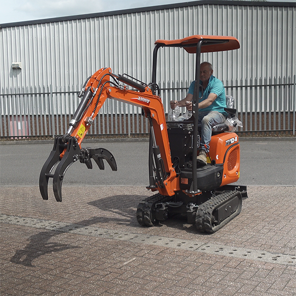 Rhinoceros micro digger operated by a driver in a light blue shirt